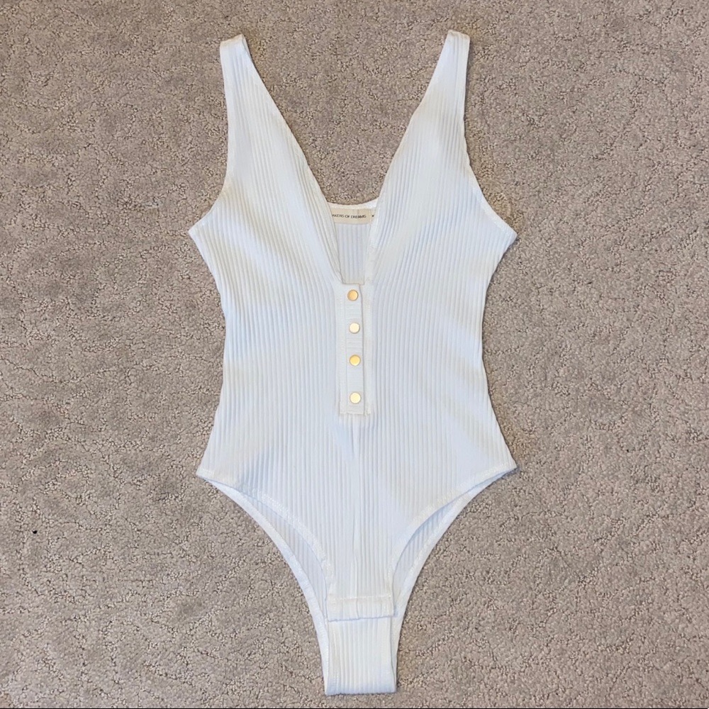 white snap button tank bodysuit